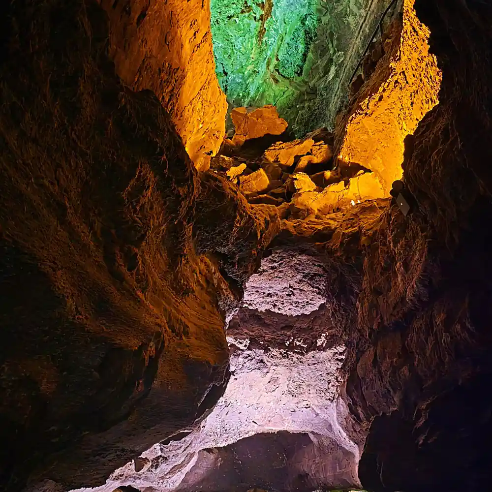 Lava tube interior with colorful mineral formations