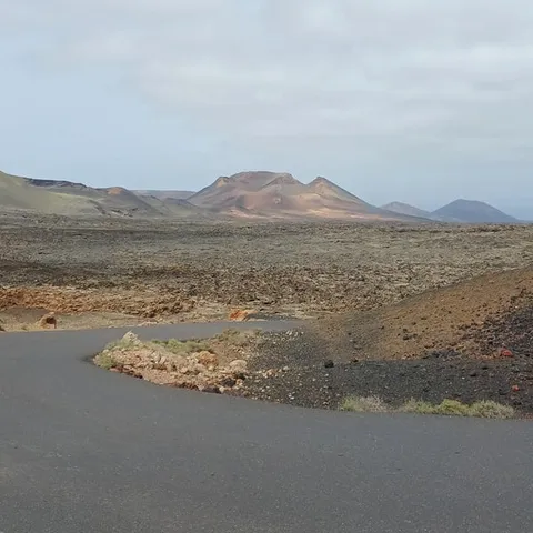 The volcano route road winding through Timanfaya's lava fields